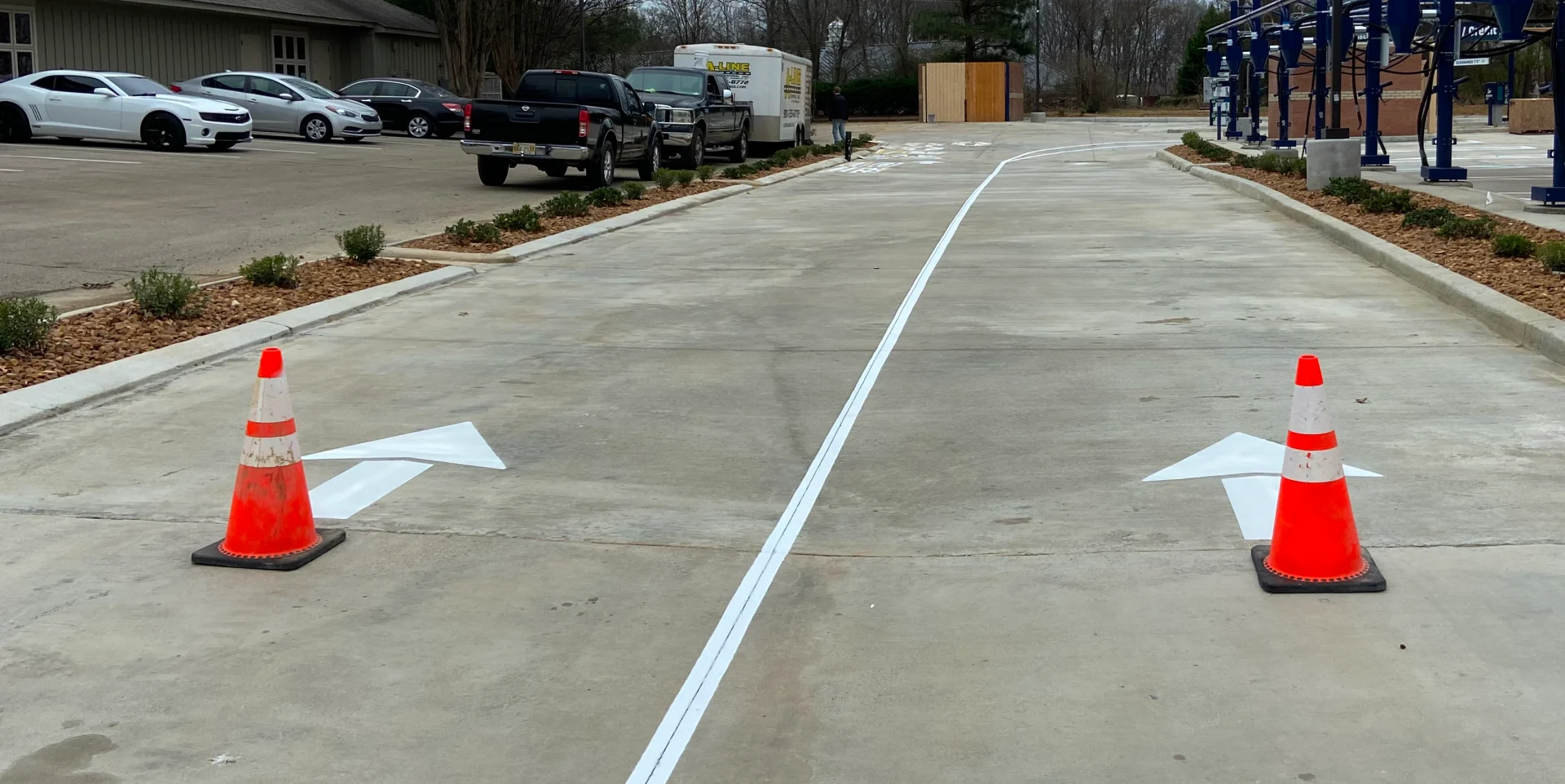One Way road marking with red cones
